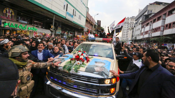 Mourners surround a vehicle carrying the coffins of Iranian Maj. Gen. Qassem Soleimani and Iraqi militia leader Abu Mahdi al-Muhandis, during a funeral procession Saturday in Baghdad. Photo from NPR