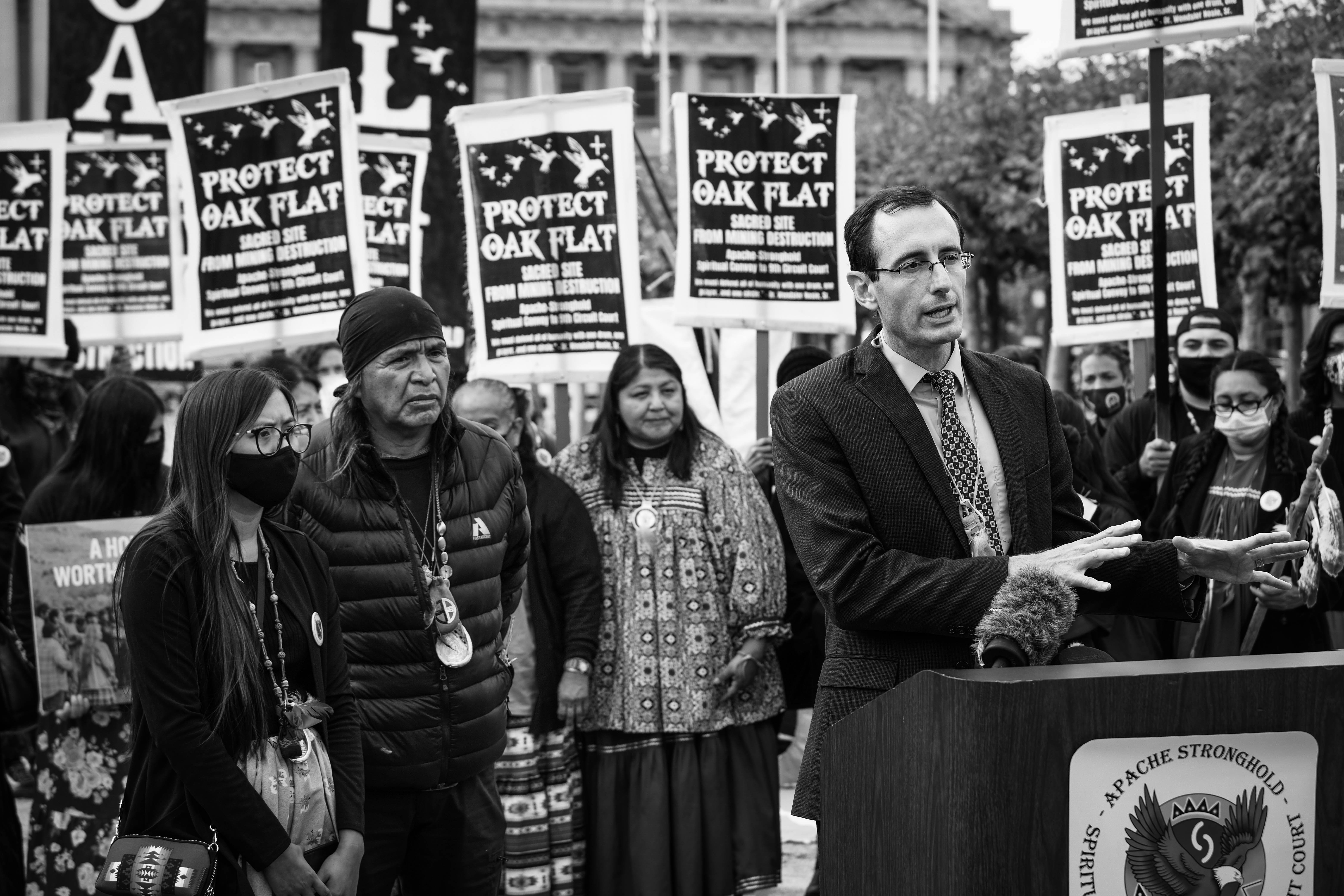 a group of people holding signs