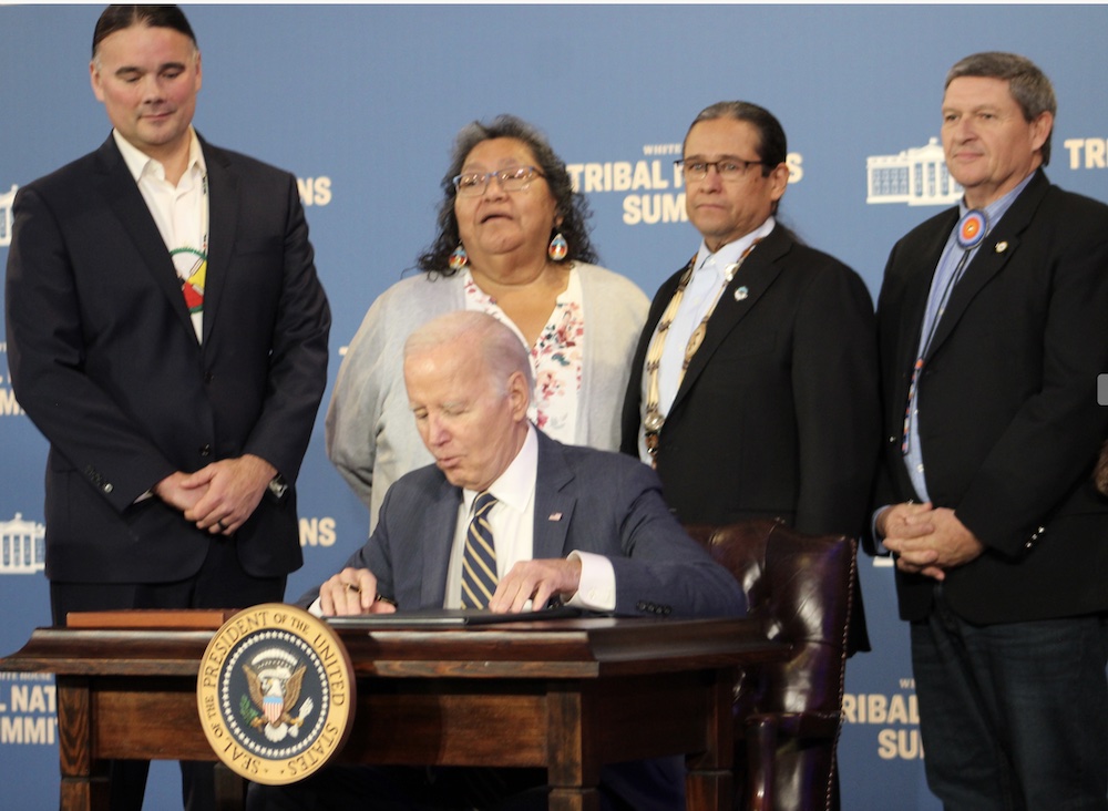 President Joe Biden signs executive order at the White House Tribal Nations Summit on December 7, 2023. (Photo/Levi Rickert for Native News Online)