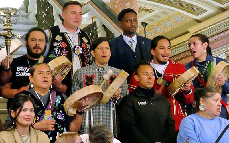 Attendees of the 2025 Native American Summit at the Illinois State Capitol pose for a photo on the Capitol rotunda alongside state Rep. Maurice West, D-Rockford, top right. West convenes a working group on Native American issues at the Capitol. (Capitol News Illinois photo by Andrew Campbell)