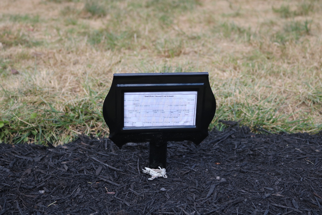 A temporary grave marker replaces what was previously Edward Spott’s headstone, now reinterred with an unidentified girl. (Photo:Jenna Kunze)