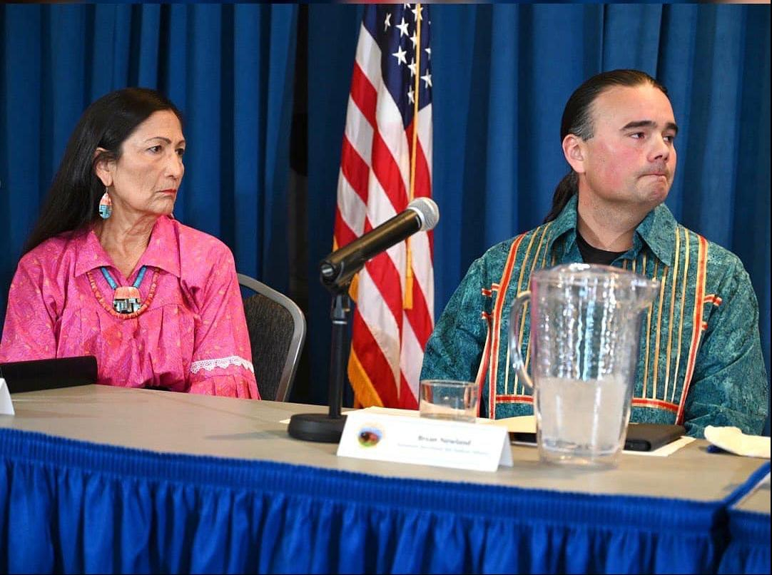 Interior Secretary Deb Haaland and Assistant Secretary Bryan Newland at a press conference on the Indian Boarding School Report (Courtesy NABS)