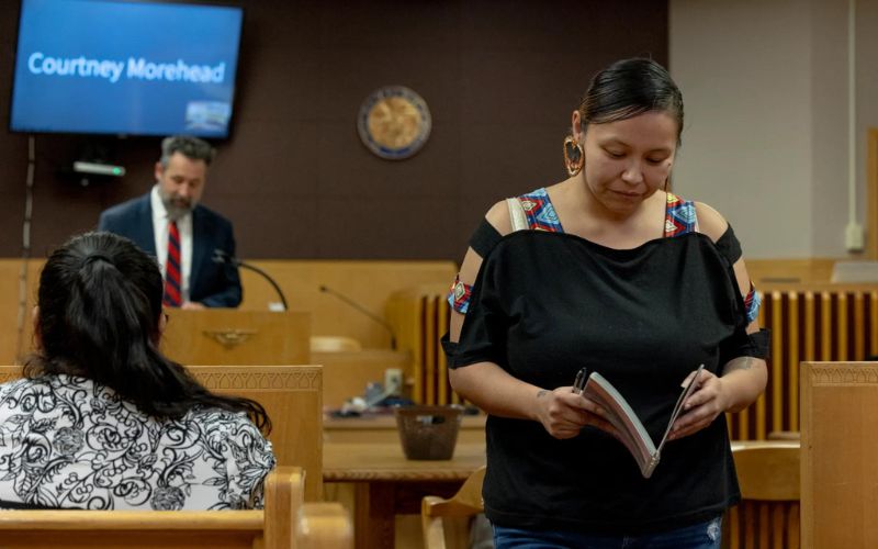Katarina Stewart returns to her seat in treatment court after meeting with Judge Rod Souza for the Indian Child Welfare Act Family Recovery Court in Billings on Jan. 3, 2024. Credit: Tailyr Irvine / MTFP