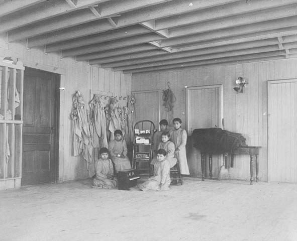 Native American boarding school Six students posed in room