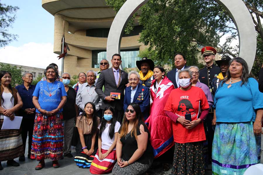 Rep. Kai Kahele, D-Hawaii, stands with Wounded Knee descendants in front of the National Native American Veterans Memorial outside the Smithsonian National Museum of the American Indian in Washington. (Photo courtesy of Rep. Kai Kahele.)