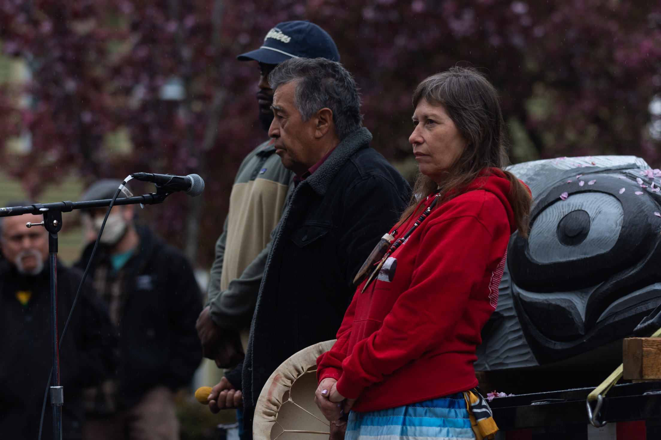 Lummi Tribal members Siam'el wit, right, and Doug James joined by fly angler Jian Lawrence offer prayer and song to bless the totem pole at the The Snake River to Salish Sea Spirit of the Waters totem pole journey launch Tuesday, May 3, 2022 at Bellingham Unitarian Fellowship in Bellingham, Wash. (photo/Natasha Brennan for McClatchy)