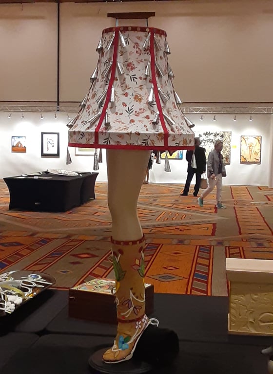 The legendary Leg Lamp from the movie “A Christmas Story” reimagined as “A Jingle Story”  by Anishinaabe, Hochunk and Lakota artist Alexa Rae, on display at the 99th Annual Santa Fe Indian Market Best of Show  preview and celebration at the Santa Fe Community Convention Center on Friday, Aug. 20. 