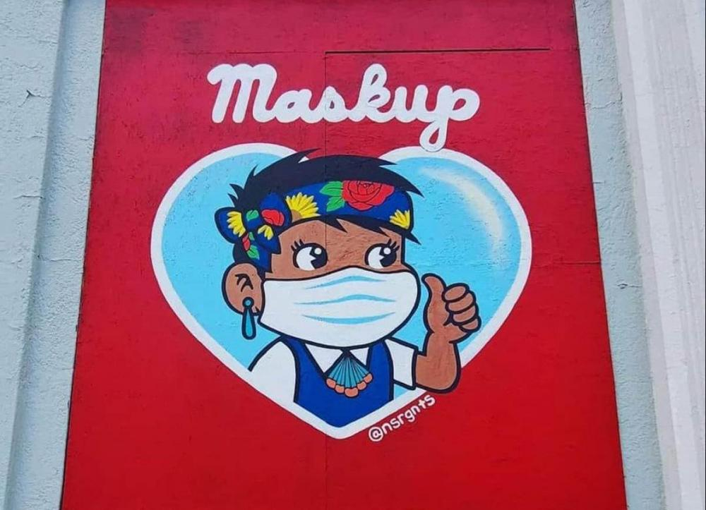 mural of boy with mask