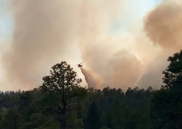 Helicopter attempting to contain fire near Wood Springs, Arizona on Navajo Nation on Wednesday, July 1, 2020.