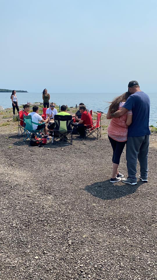Singers from the Grand Portage Indian Reservation sang on the shores of Lake Superior on July 17, the day after Ricky Balsimo's remains were found dismembered. (Photo/Raquel Turner)