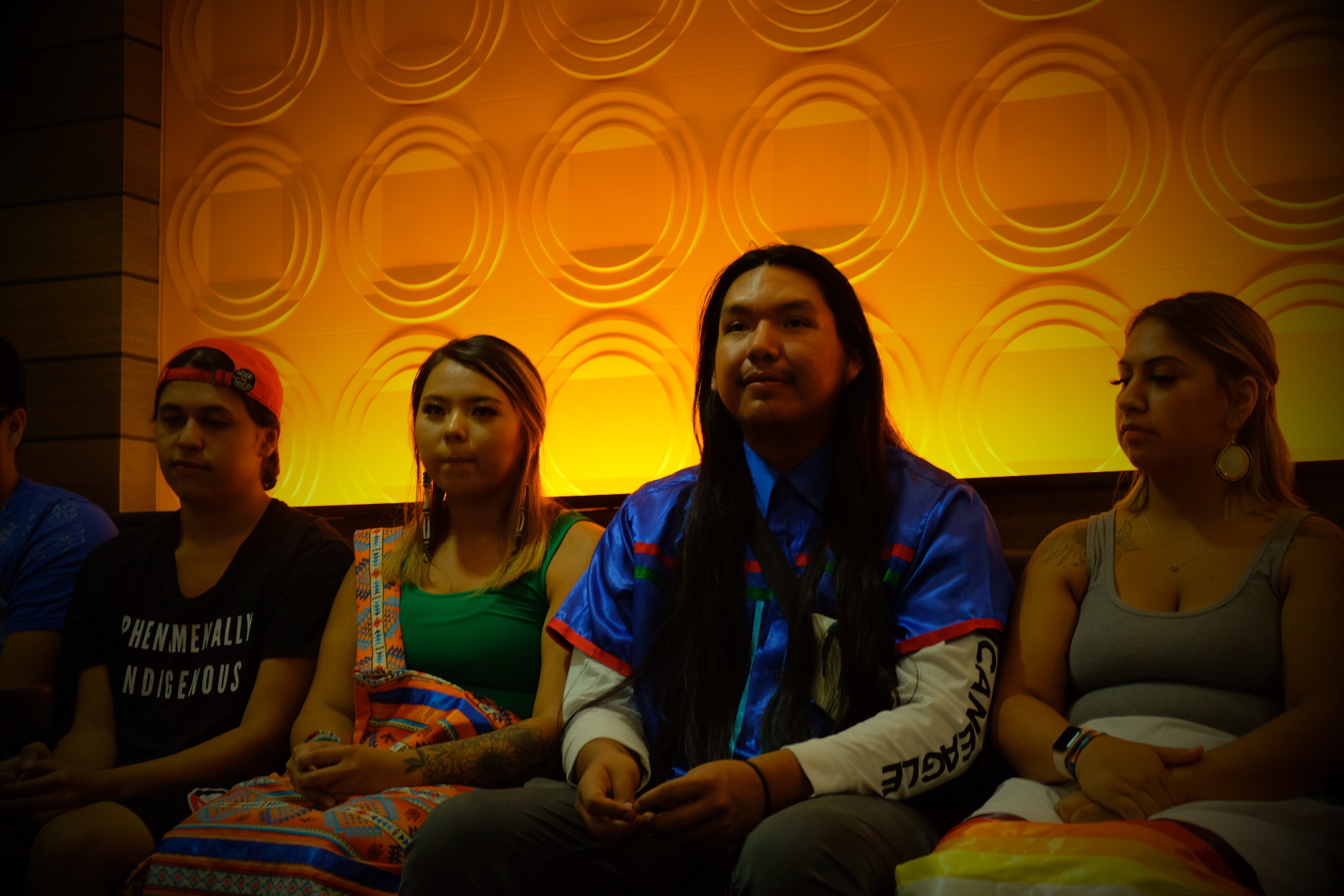 Christopher Eagle Bear, 23, is flanked by (left) Asia Black Bull, 21, and (right) Mahpiya Murray, 23, all three of whom were original youth council members who visited Carlisle in 2015 and began the effort to exhume and repatriate their relatives. (Photo: Jenna Kunze)