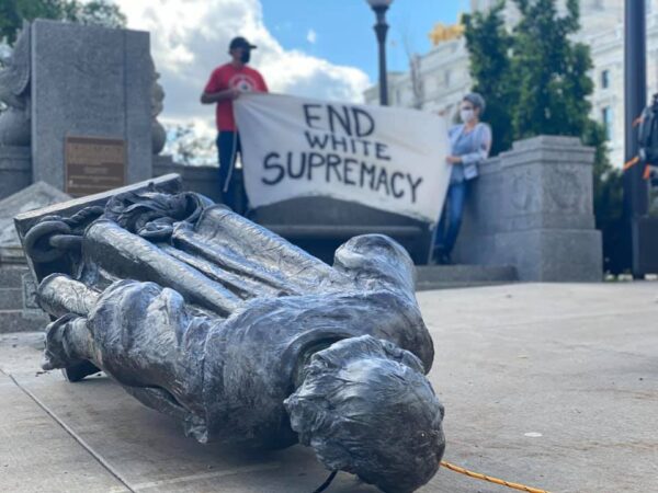 Statue of Christopher Columbus toppled from its stand on east side of the Minnesota State Capitol.  Native News Online photograph by Darren Thompson