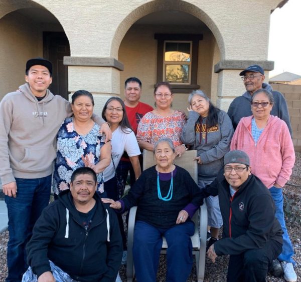 Courtesy PhotoJean DeJolie, center, poses for a family portrait. DeJolie, a former Naatsis’áán Chapter official and a longtime educator with a master’s degree, is currently fighting for her life in the ICU at Tuba City Regional Health Care. She and her son, Douglas, attended Navajo Mountain Alliance Church the day after members attended the March 7 Chilchinbeto Church of the Nazarene Zone Rally. Douglas died on March 26.