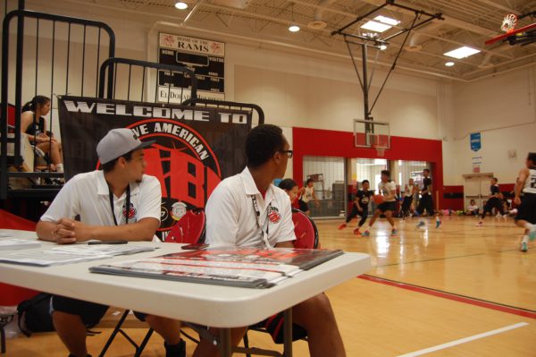 NABI staff watching the game from sign in table in GYM 1B at Maricopa High School in Maricopa, Ariz. on June 27, 2016.