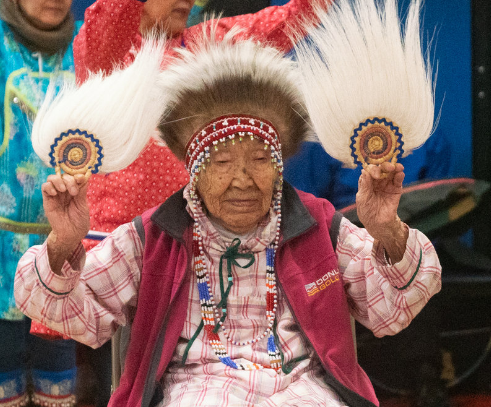 Alaska Native 90-year-old, Lizzie Chimiugak, the first American counted in the 2020 Census on Tuesday, celebrates with her community. NPR photo