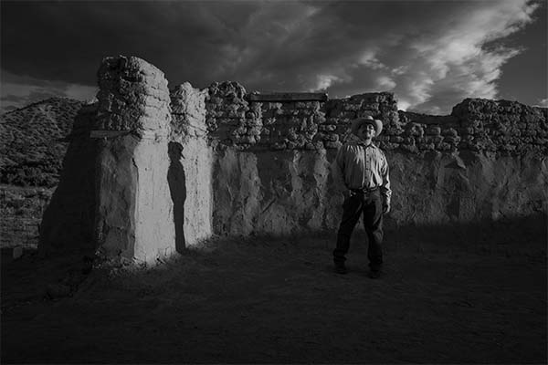 4 Genízaro Delvin Garcia standing in the remains of 18th century Santa Rosa de Lima Church in Abiquiú, New Mexico. Photo by Russel Albert Daniels, 2019.