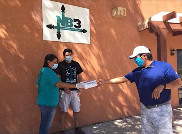 Lone Pine Wellness Center Director Mariah David presented Begay and NB3 with a donation of protective masks.