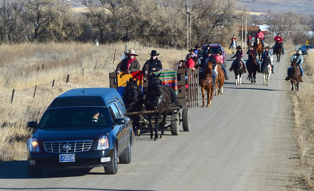 A horse drawn wagon carries the casket during the funeral of Selena Not Afraid in Hardin on Sunday.