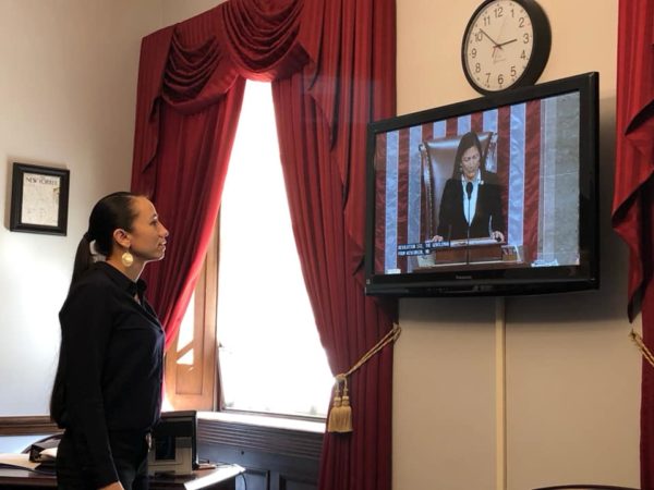 Rep. Sharice Davids watching Rep. Deb Haaland at the Speaker's seat in Congress on last year. The two will serve on Congressional Escort Committee for tonight's State of the Union address.