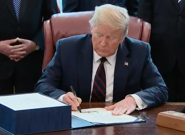 President Donald Trump signs the Coronavirus Aid, Relief and Economic Securities (CARES) Act, which includes more than $10 billion in aid for Indian Country.