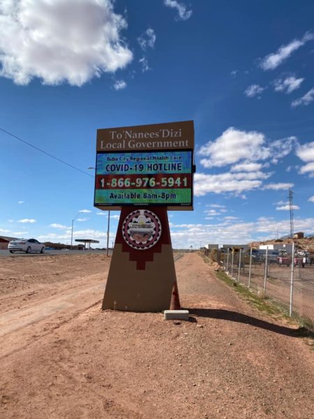 Signs on Navajo Nation provide public service announcments about the COVID-19 pandemic.