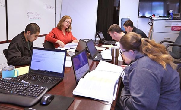 Northeastern State University accounting student Jorge Morales, Cherokee Nation Commerce mortgage officer Cora Lathrop, and NSU accounting students Hunter Watkins, Michael Ford and Bailey Shepherd train for the Volunteer Income Tax Assistance program.