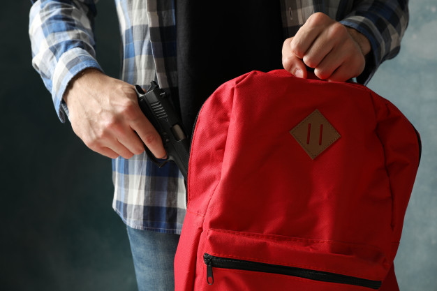 man carrying backpack