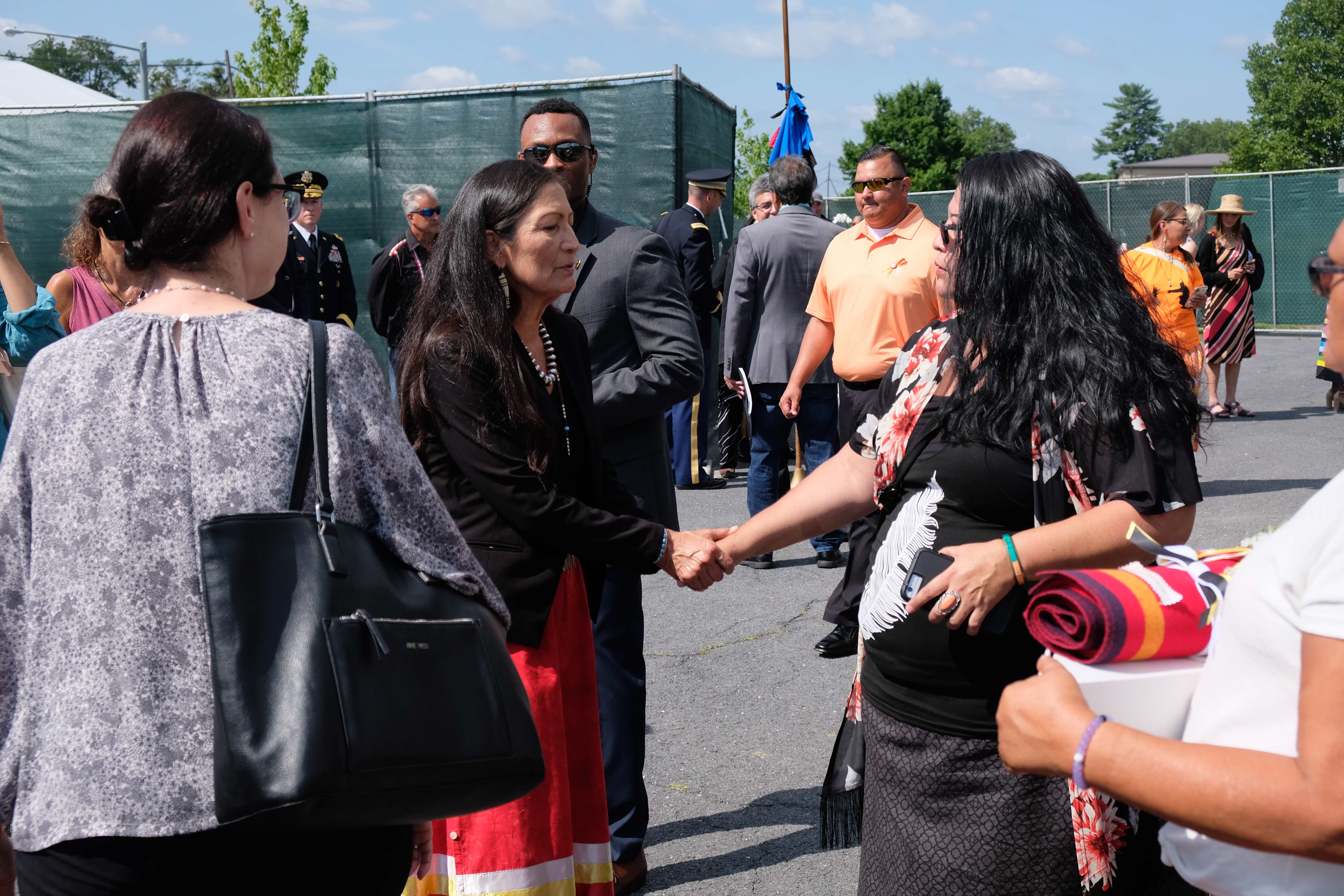 Sec. Deb Haaland hears from a tribal member after the ceremony. (Photo/Jenna Kunze)