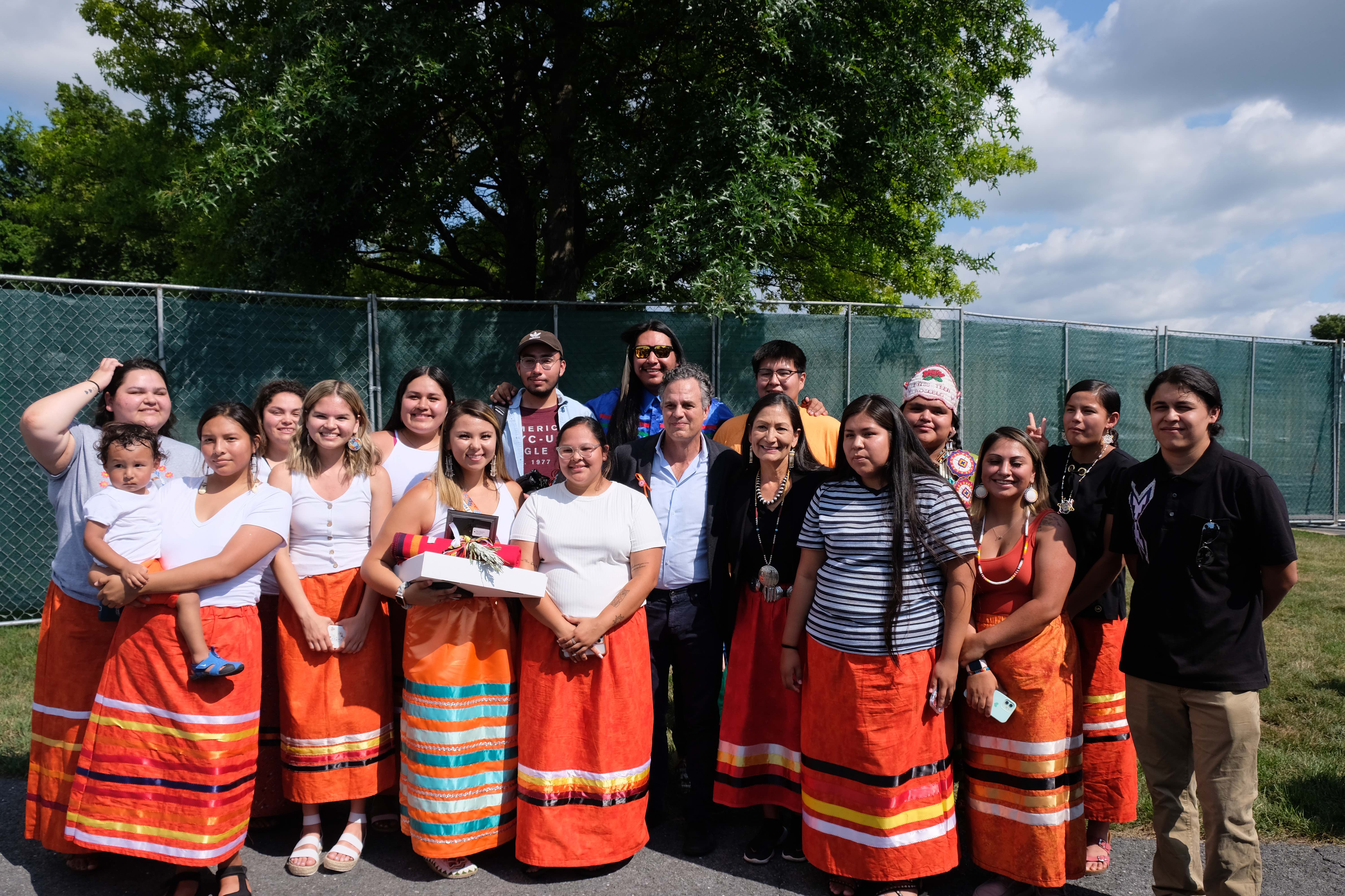 Members of the Sicangu Youth Council pose with Interior Secretary Deb Haaland and actor and activist Mark Ruffalo. (Photo/Jenna Kunze)